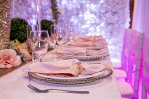Table Display-Pink linens and glass plates