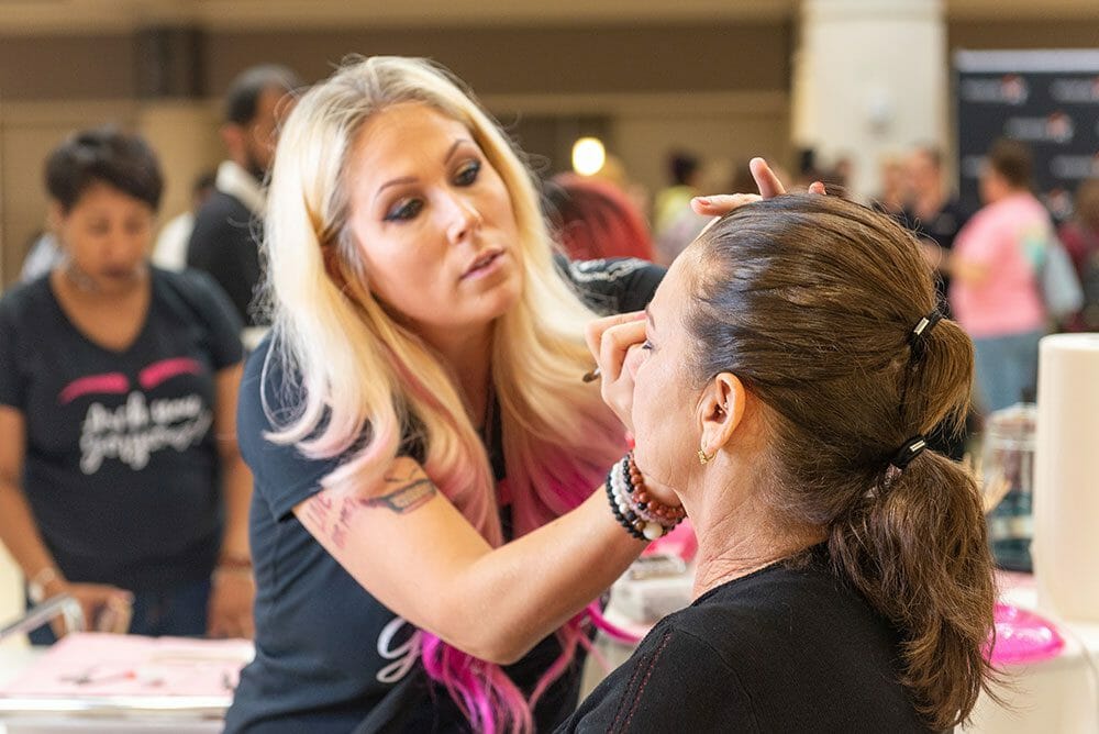 Makeup artist applying makeup